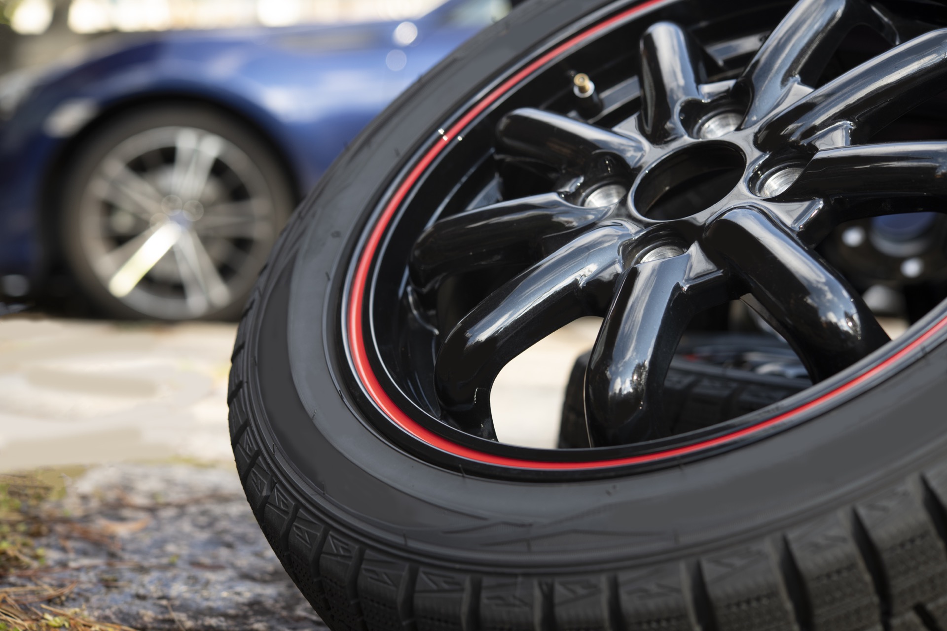 Tire on side about to be rotated onto car